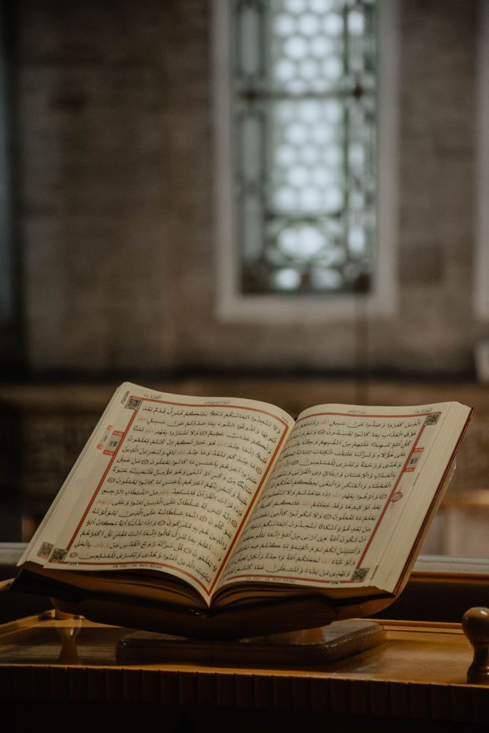 An open Arabic book inside a mosque showcasing cultural literacy.